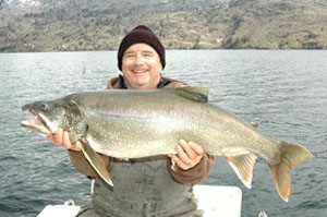 Anton Jones of Darrell and Dads Guide Service with a huge 23 pound Lake Chelan Mackinaw trout